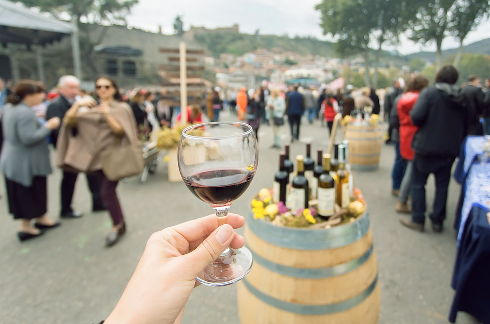 picture of a glass of wine at a festival