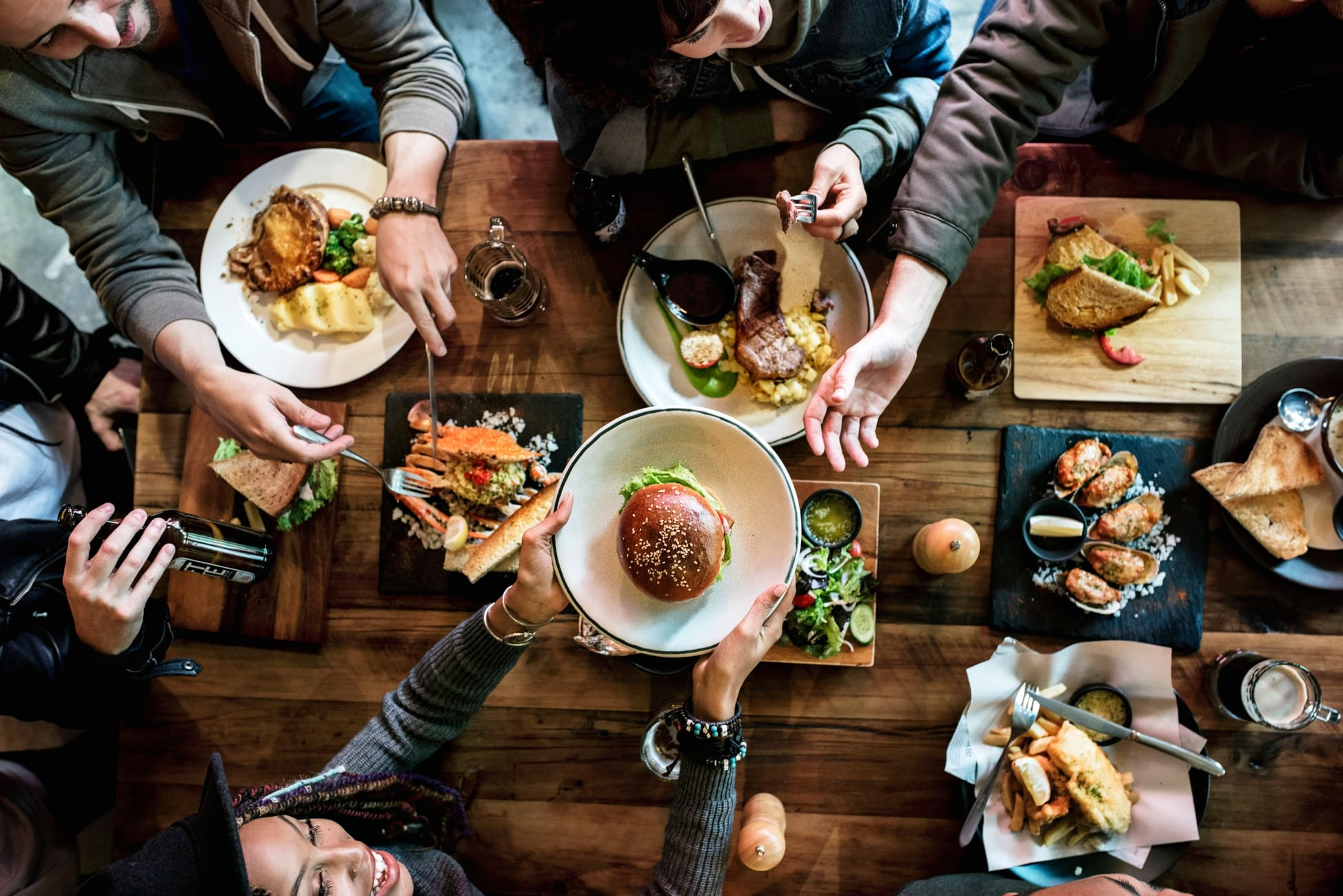 Friends all together at restaurant having meal